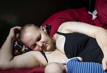 Photo of trans-dad chest-feeding son tells beautiful a story