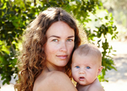 Mother and baby bare skin outdoors